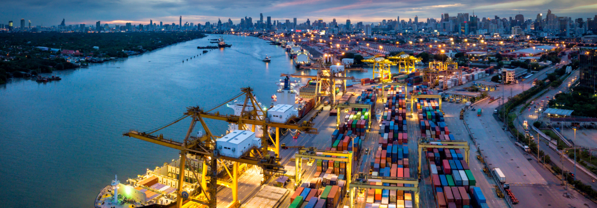 Aerial view of international port with Crane loading containers in import export business logistics