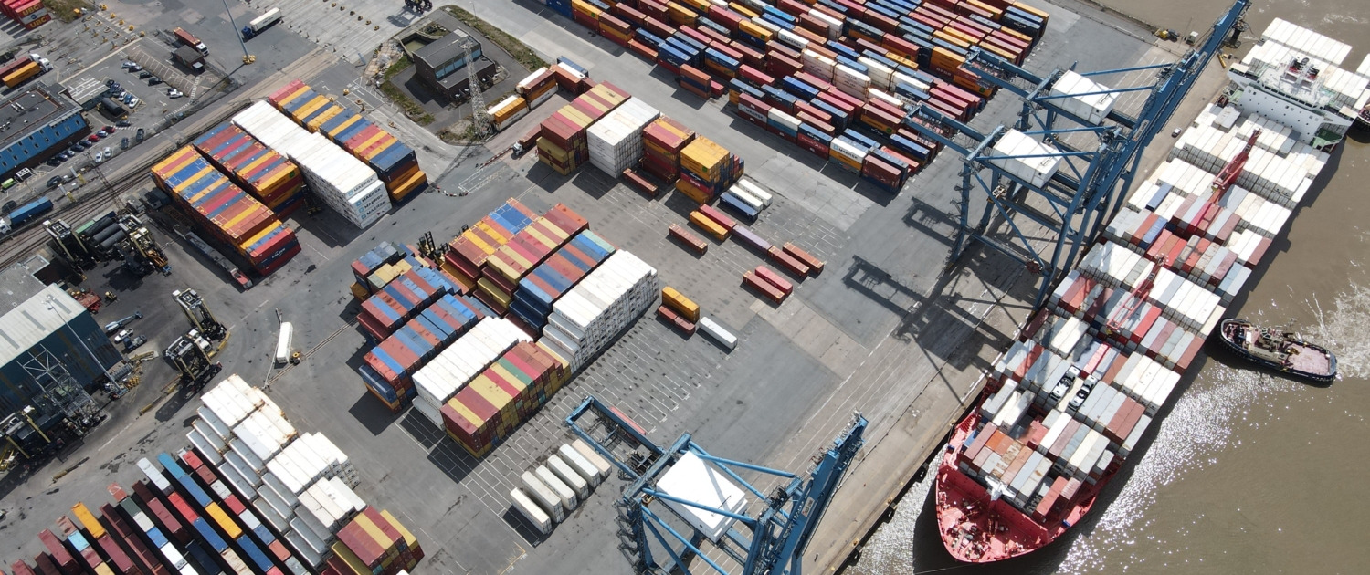 Tilbury Docks on River Thames UK container ships loading overhead aerial view Port of Tilbury